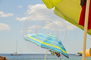 Image of colorful sea umbrellas with the sea and the sky