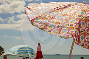 Image of colorful sea umbrellas with the sea and the sky
