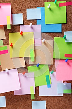 Image of colorful sticky notes on cork bulletin board