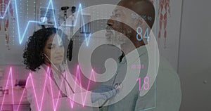 Image of colourful cardiographs over diverse patient and doctor treating