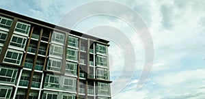 Image of condo on afternoon with Blue sky background.