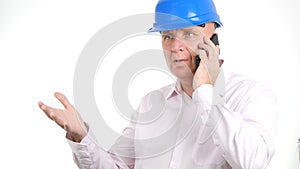 Image with a Confident Engineer Talking to Mobile and Gesticulating Upset