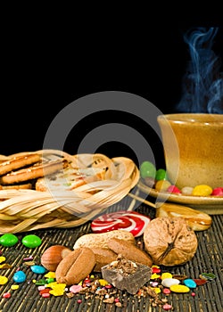 Image of cookies, cup of coffee, chocolate, candy closeup