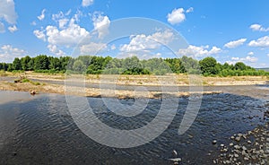 Image of countryside landscape river and small forest