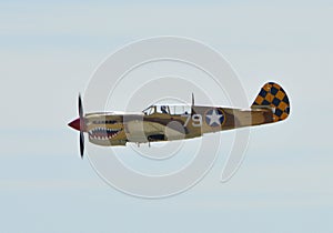Curtiss P-40 Warhawk Flying on clear sky