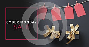 Image of cyber monday sale text over gift tags and boxes