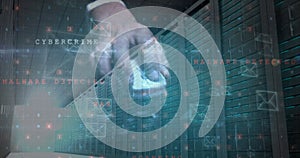 Image of cyberattack and envelope icons over and using computer mouse server room