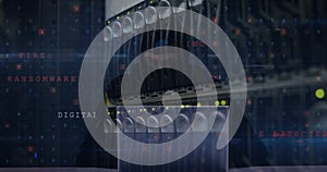 Image of cyberattack over server room and hacker using laptop