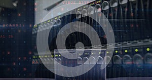 Image of cyberattack over server room and hacker using laptop