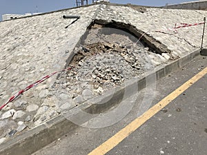 Image of an Damaged rip rap stones slope protection work due to poor workmanship and supervision which leads to collapse of an