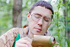 Image of dark-haired biologist in glasses