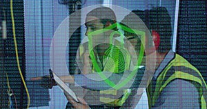 Image of data over diverse male and female it engineers with tablet by computer server