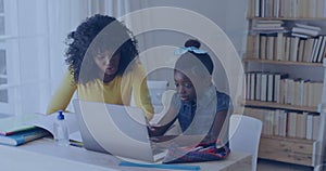 Image of data over happy african american mother and daughter using laptop for school homework
