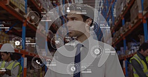 Image of data processing against caucasian male supervisor using digital tablet at warehouse