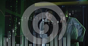 Image of data processing, diverse male and female it engineers with laptop by computer servers