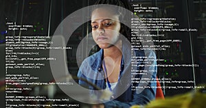 Image of data processing over african american businesswoman using laptop