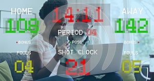 Image of data processing over african american couple using laptop photo