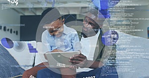 Image of data processing over african american father and son using tablet