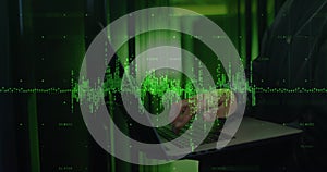 Image of data processing over asian it technician using laptop by computer servers