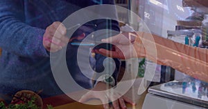 Image of data processing over biracial man paying with smartphone