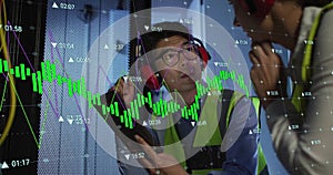 Image of data processing over biracial man using tablet in server room