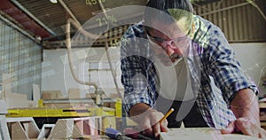 Image of data processing over caucasian male carpenter working in workshop