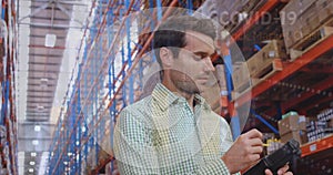 Image of data processing over caucasian male worker in warehouse