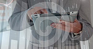 Image of data processing over caucasian man using tablet