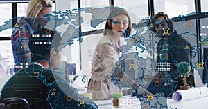 Image of data processing over diverse business people at meeting