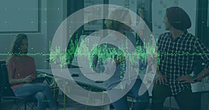 Image of data processing over diverse female and male colleagues smiling at office