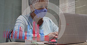 Image of data processing over senior caucasian woman wearing face mask and using laptop