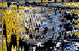 INTERSECTING WAVE PATTERN IN BLUE AND YELLOW