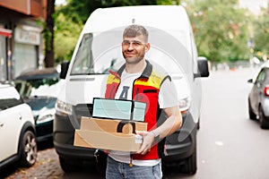 Image of delivery man holding parcel box