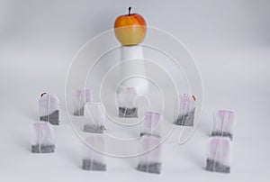 The image of the demonstration in the form of tea bags and apples