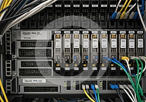Complex server rack with networking equipment and interconnected cables