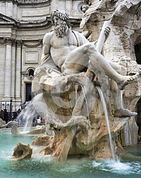 detail of the fountain of the four rivers, ganges allegorical statue, piazza navona, rome