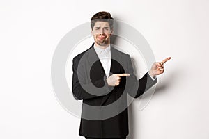 Image of devestated man in party suit, crying and complaining, pointing fingers right at something disappointing