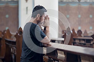 Devout man praying in the church