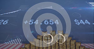 Image of digital data processing over stacks of coins