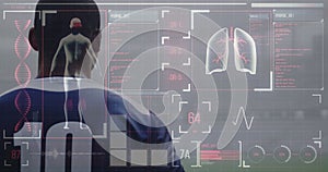 Image of digital interface with medical data processing over rugby players