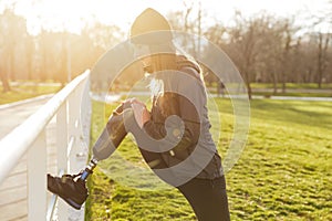 Image of disabled athletic girl in sportswear, doing sports and