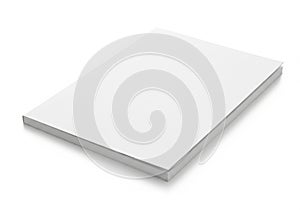 A thick stack of white paper sheets neatly arranged on a flat surface