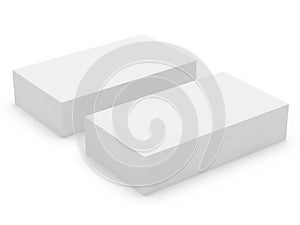 Pair of white rectangular blocks on light background