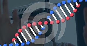 Image of dna strand over caucasian woman using vr headset