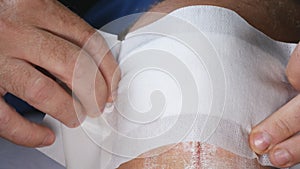 Doctor Applying a New and Clean Bandage on a Foot Wound