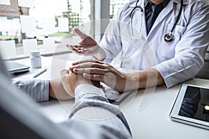 Image of doctor holding patient`s hand to encourage, talking with patient cheering and support, healthcare and medical assistant