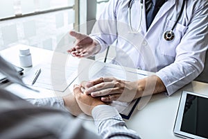 Image of doctor holding patient`s hand to encourage, talking with patient cheering and support, healthcare and medical assistant