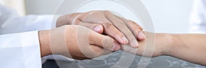 Image of doctor holding patient`s hand to encourage, talking with patient cheering and support, healthcare and medical assistant