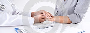 Image of doctor holding patient`s hand to encourage, talking with patient cheering and support, healthcare and medical assistant