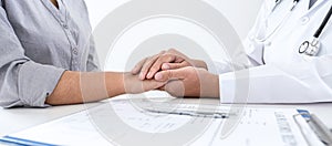 Image of doctor holding patient`s hand to encourage, talking with patient cheering and support, healthcare and medical assistant